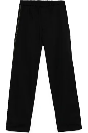 UNDERCOVER Pantaloni con banda logo