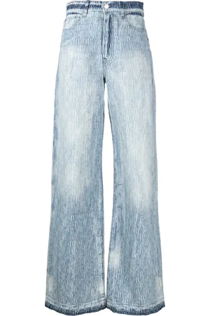 AMIRI Jeans a gamba ampia con logo jacquard