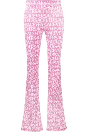VERSACE Pantaloni svasati con stampa