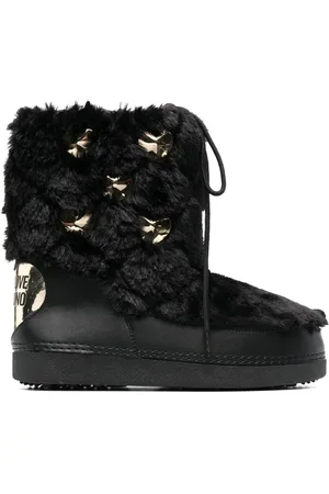Moschino Stivali con borchie in finta pelliccia