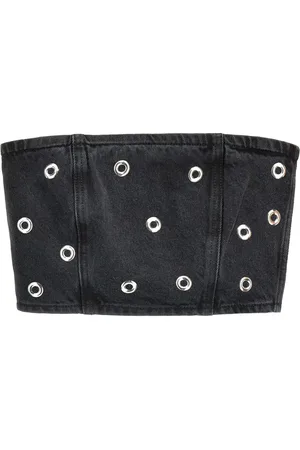 ROTATE Top denim con borchie
