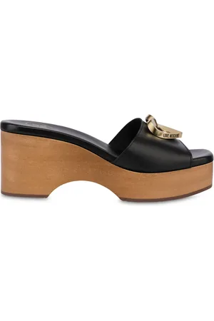 Moschino Mules con placca logo