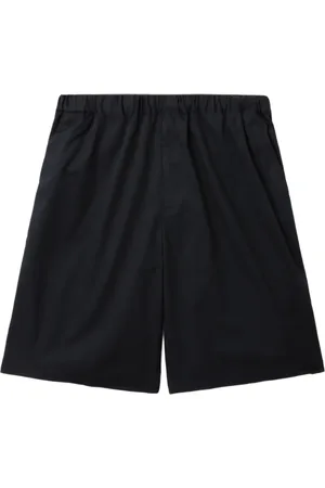 UNDERCOVER Shorts con logo