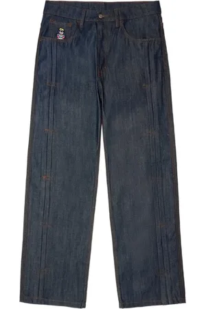 KIDSUPER STUDIOS Jeans Raw a gamba ampia