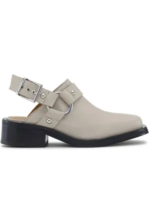 Ganni Mules con cinturino posteriore
