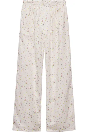 Prada Pantaloni in cotone con stampa a fiori