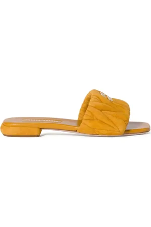 Miu Miu Sandali slides in pelle scamosciata matelassé