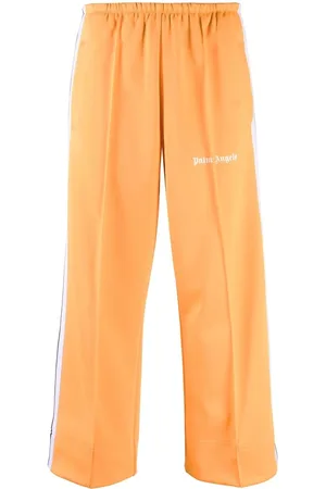 Palm Angels Pantaloni sportivi crop con banda laterale