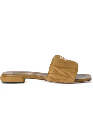 Miu Miu Sandali slides in pelle scamosciata matelassé