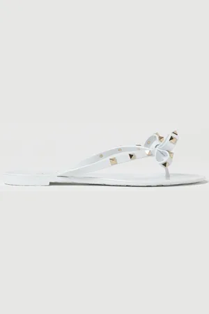 VALENTINO GARAVANI Infradito Rockstud in gomma con fiocco