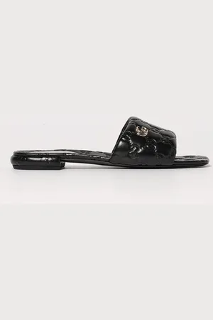 Gucci Mules in nappa con monogram GG goffrato
