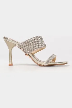 Twenty Fourhaitch Mules Sadira in pelle laminata con strass all over