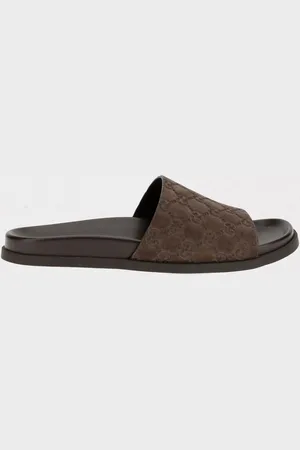 Gucci Sliders GG in camoscio con monogram goffrato