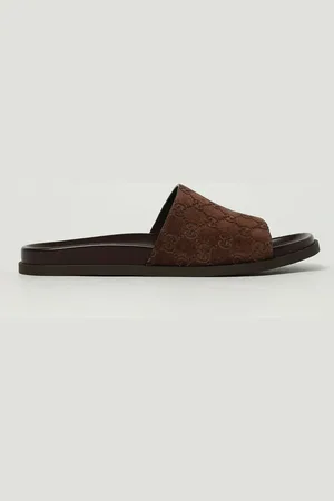 Gucci Sliders in camoscio con monogram GG goffrato