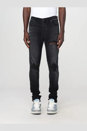AMIRI Jeans in denim distressed