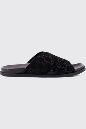 Gucci Sliders in camoscio con monogram GG goffrato