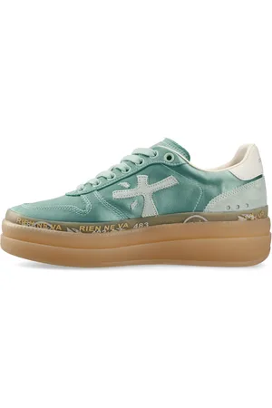 Premiata Sneakers in tessuto e inserti in pelle scamosciata.