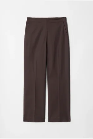 H&M Pantaloni slim con pieghe pressate
