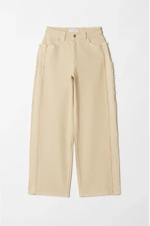 H&M Jeans a gamba larga con frange