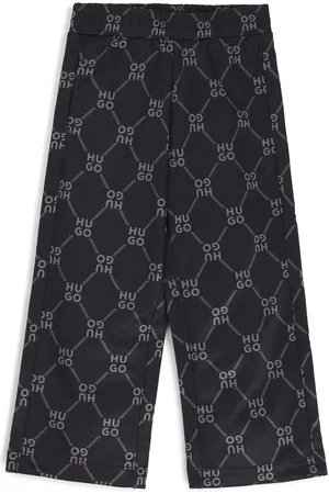 HUGO BOSS Pantaloni della tuta per bambini con fit morbido e stampa del logo scomposto
