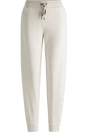 HUGO BOSS Pantaloni della tuta con fondo gamba elastico e cordoncino con righe tipiche del marchio