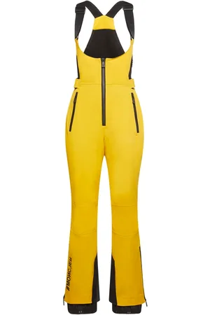 Abbigliamenti da sci nel colore giallo per donna