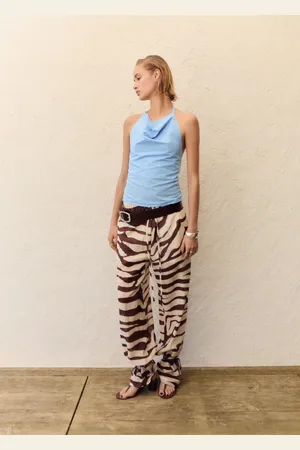 MANGO Pantaloni fluidi con stampa zebrata