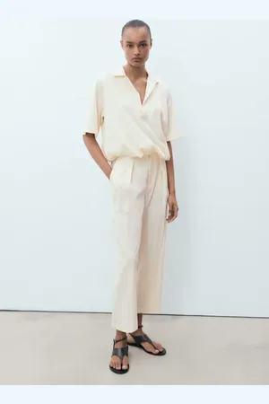 MANGO Pantaloni crop fluidi