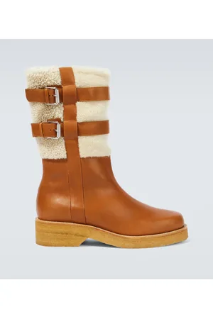 Christian Louboutin Stivali in pelle con shearling