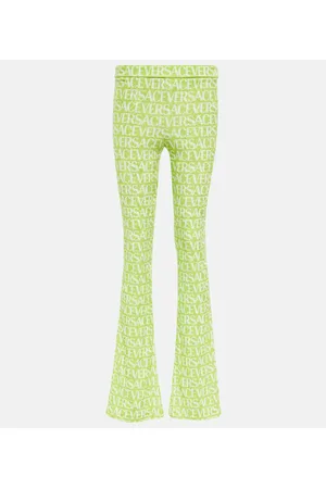 VERSACE Pantaloni flared in velluto con logo