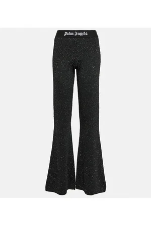 Palm Angels Pantaloni flared a vita media con stampa