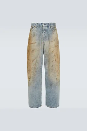 Acne Studios Jeans a gamba larga distressed