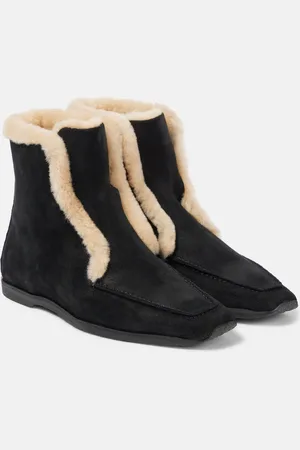 Totême Stivaletti in pelle con shearling