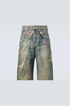 Acne Studios Shorts di jeans con stampa