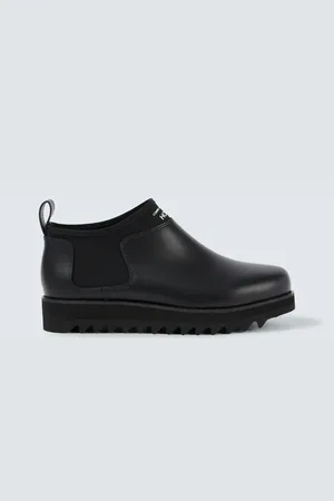 Comme des Garçons Comme des Garçons Homme Stivali in pelle con logo