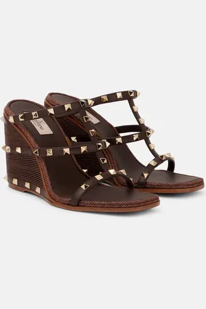 VALENTINO GARAVANI Mules Rockstud in pelle con zeppa