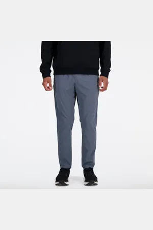 New Balance Uomo AC Tapered Pant 29", Politessuto