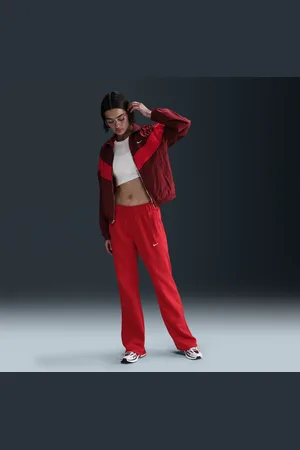 Nike Pantaloni slim fit a vita media in maglia Sportswear Windrunner – Donna