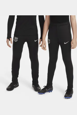 Nike Pantaloni da calcio in maglia Dri-FIT FC Barcelona Strike – Ragazzo/a