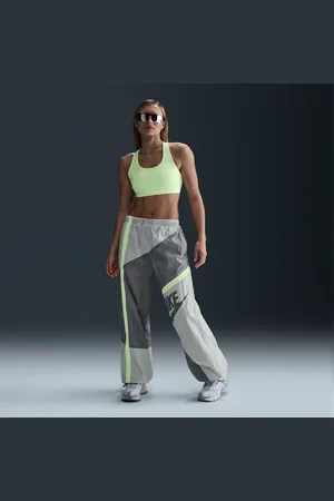 Nike Pantaloni a vita media in tessuto con bordo aperto Sportswear – Donna