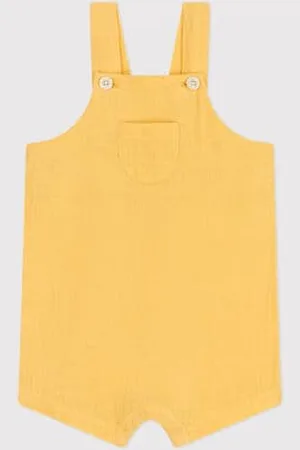 Petit Bateau Salopette corta in garza di cotone tinta unita neonato