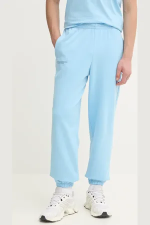 The Pangaia Pantaloni della tuta di cotone colore turchese