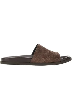 Gucci Slides in pelle scamosciata con motivo GG Uomo 9