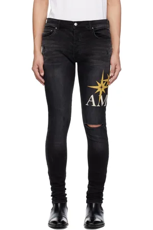AMIRI Black Starburst Applique Skinny Jeans