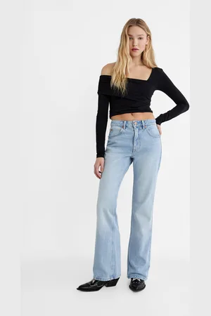 Jeans flare anni 90 con strappi hot sale