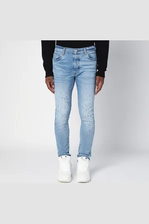 AMIRI Jeans skinny azzurro slavato con usure