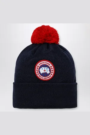 Canada Goose Cuffia blu navy in lana con pon pon