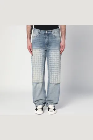 AMIRI Jeans slavato con pannello decorato