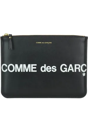 Comme des Garçons Busta in pelle con maxi logo