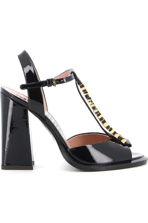 Moschino Sandali in vernice con logo dorato